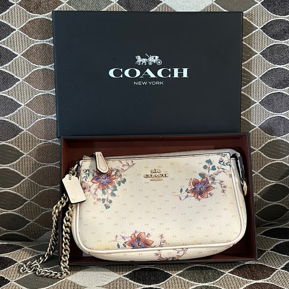 Coach wristlet purse comes with box and care instructions